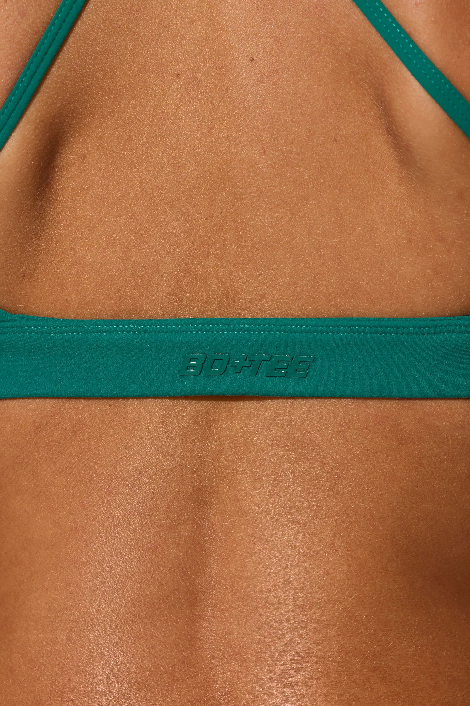 Evolve - Multiway Twist Front Sports Bra in Teal Green
