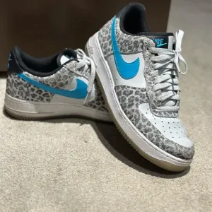 Nike Leopard Print Sneakers with Blue Swoosh